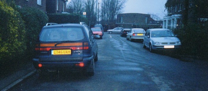 8am - in the morning. Cars are parked on the road by city workers who walk in to work and return to collect their cars in the evening.